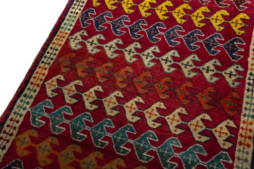 Backside of handmade 2000s Persian Gabbeh rug showing knot structure and weave density