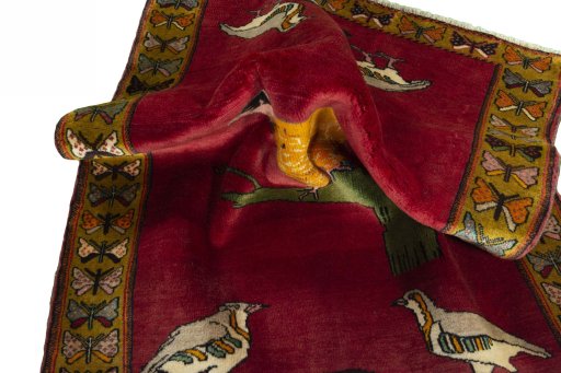 Corner detail of 2000s Persian Gabbeh rug showing border pattern and Wool pile