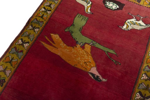 Backside of handmade 2000s Persian Gabbeh rug showing knot structure and weave density
