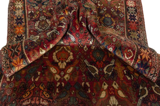 Corner detail of 2000s Persian Gabbeh rug showing border pattern and Wool pile