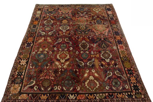 Surface texture of 2000s Persian Gabbeh rug with natural Wool and intricate pattern
