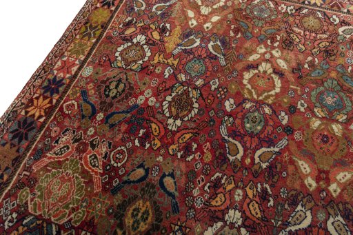 Backside of handmade 2000s Persian Gabbeh rug showing knot structure and weave density