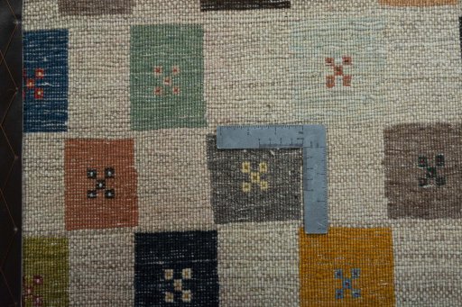 Corner detail of New Persian Gabbeh rug showing border pattern and Wool pile