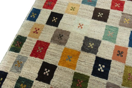 Backside of handmade New Persian Gabbeh rug showing knot structure and weave density