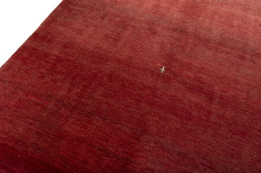 Backside of handmade New Persian Gabbeh rug showing knot structure and weave density