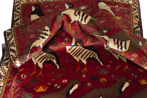 Corner detail of 1970s Persian Gabbeh rug showing border pattern and Wool pile
