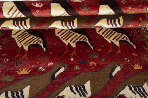 Full view of 1970s Persian Gabbeh rug from Iran / Persia, 186 × 123 cm in Red tones
