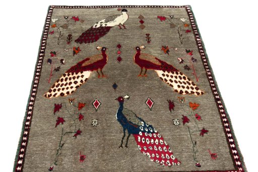 Surface texture of 2000s Persian Gabbeh rug with natural Wool and intricate pattern