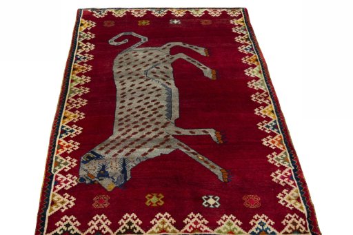Surface texture of 2000s Persian Gabbeh rug with natural Wool and intricate pattern