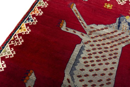 Backside of handmade 2000s Persian Gabbeh rug showing knot structure and weave density