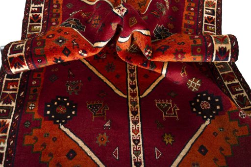 Corner detail of 2000s Persian Gabbeh rug showing border pattern and Wool pile