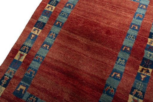 Backside of handmade New Persian Gabbeh rug showing knot structure and weave density