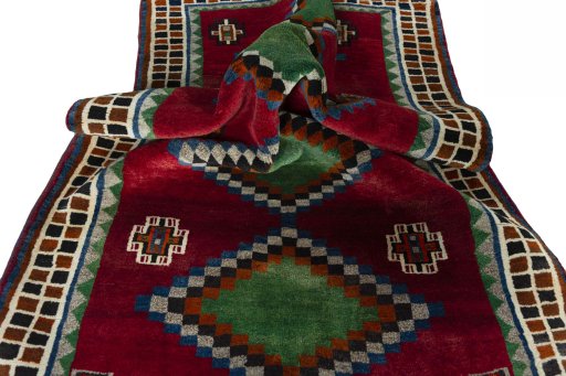 Corner detail of 2000s Persian Gabbeh rug showing border pattern and Wool pile