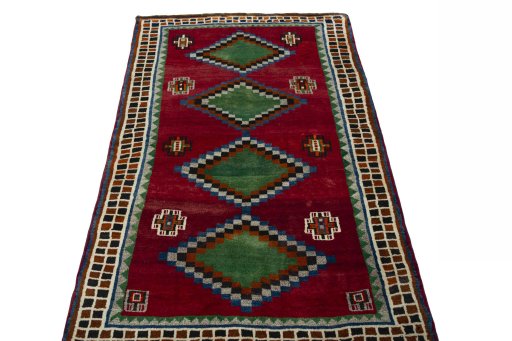 Surface texture of 2000s Persian Gabbeh rug with natural Wool and intricate pattern