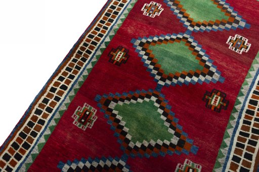 Backside of handmade 2000s Persian Gabbeh rug showing knot structure and weave density