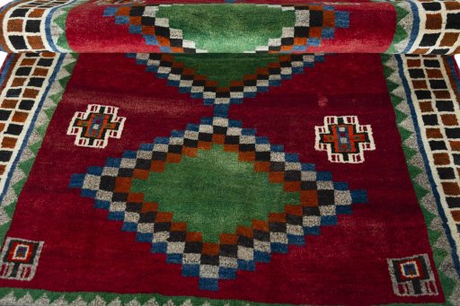 Full view of 2000s Persian Gabbeh rug from Iran / Persia, 198 × 124 cm in Red tones