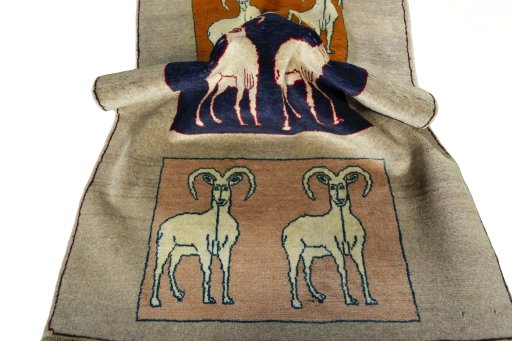 Corner detail of 2000s Persian Gabbeh rug showing border pattern and Wool pile