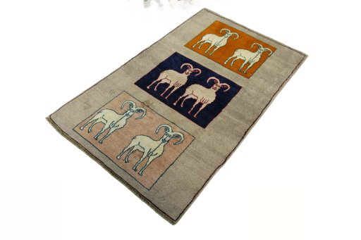 Corner detail of 2000s Persian Gabbeh rug showing border pattern and Wool pile