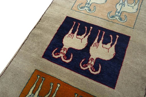 Backside of handmade 2000s Persian Gabbeh rug showing knot structure and weave density