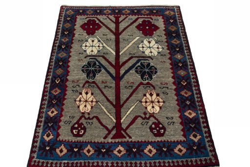 Surface texture of 2000s Persian Gabbeh rug with natural Wool and intricate pattern