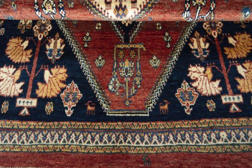 Corner detail of 2000s Persian Gabbeh rug showing border pattern and Wool pile