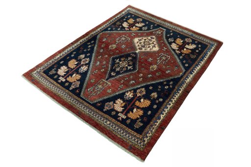 Corner detail of 2000s Persian Gabbeh rug showing border pattern and Wool pile