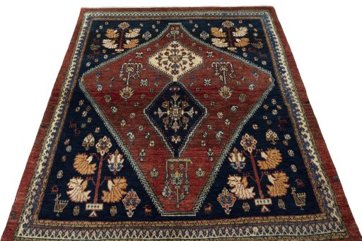 Surface texture of 2000s Persian Gabbeh rug with natural Wool and intricate pattern