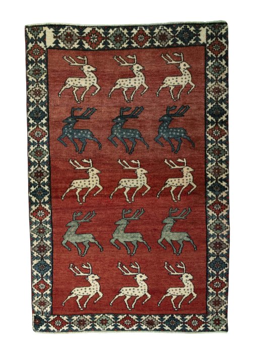 Full view of 2000s Persian Gabbeh rug from Iran / Persia, 203 × 133 cm in Red tones