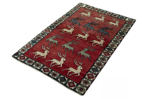 Corner detail of 2000s Persian Gabbeh rug showing border pattern and Wool pile