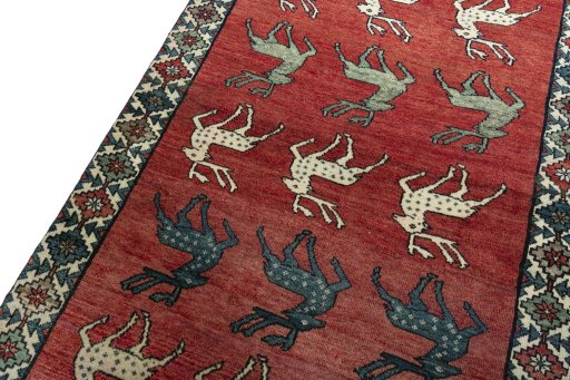 Backside of handmade 2000s Persian Gabbeh rug showing knot structure and weave density