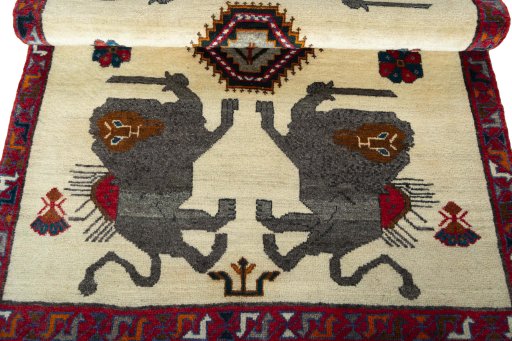 Corner detail of 2000s Persian Gabbeh rug showing border pattern and Wool pile