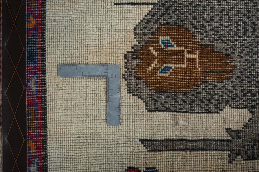 Surface texture of 2000s Persian Gabbeh rug with natural Wool and intricate pattern