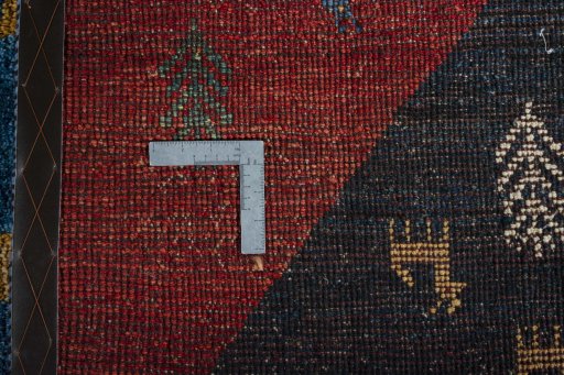 Close-up detail of 2000s Persian Gabbeh rug from Iran / Persia showing Wool weave