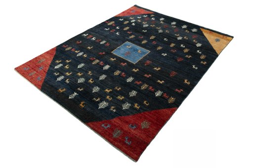 Corner detail of 2000s Persian Gabbeh rug showing border pattern and Wool pile