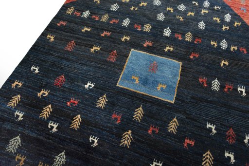 Backside of handmade 2000s Persian Gabbeh rug showing knot structure and weave density