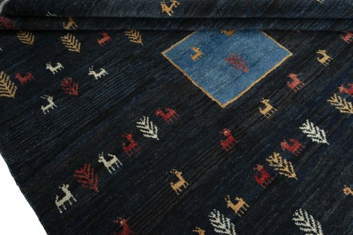 Full view of 2000s Persian Gabbeh rug from Iran / Persia, 298 × 224 cm in Blue tones