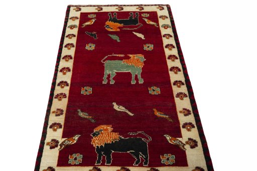 Surface texture of 2000s Persian Gabbeh rug with natural Wool and intricate pattern