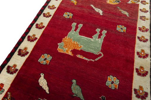 Backside of handmade 2000s Persian Gabbeh rug showing knot structure and weave density