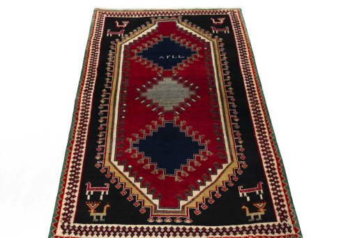 Surface texture of 2000s Persian Gabbeh rug with natural Wool and intricate pattern