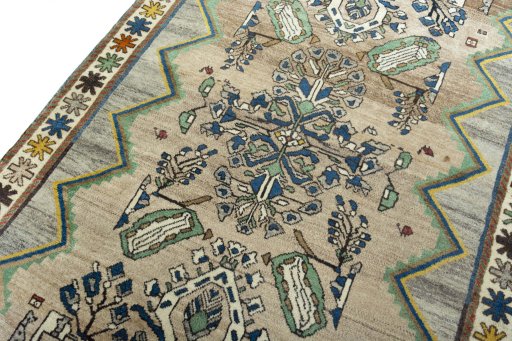 Backside of handmade 2000s Persian Gabbeh rug showing knot structure and weave density