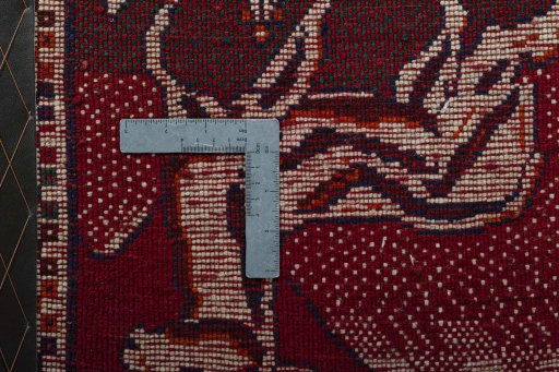 Backside of handmade 2000s Persian Gabbeh rug showing knot structure and weave density