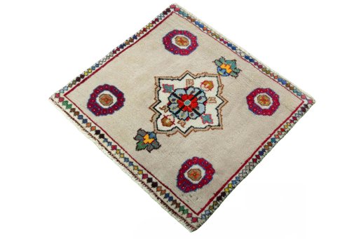 Corner detail of 2000s Persian Gabbeh rug showing border pattern and Wool pile