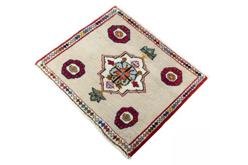 Corner detail of 2000s Persian Gabbeh rug showing border pattern and Wool pile