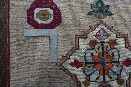 Backside of handmade 2000s Persian Gabbeh rug showing knot structure and weave density