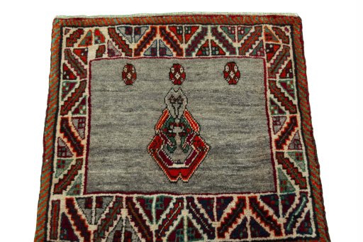Surface texture of 2000s Persian Gabbeh rug with natural Wool and intricate pattern