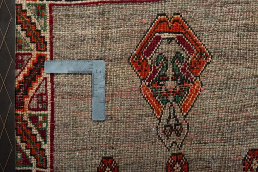 Backside of handmade 2000s Persian Gabbeh rug showing knot structure and weave density
