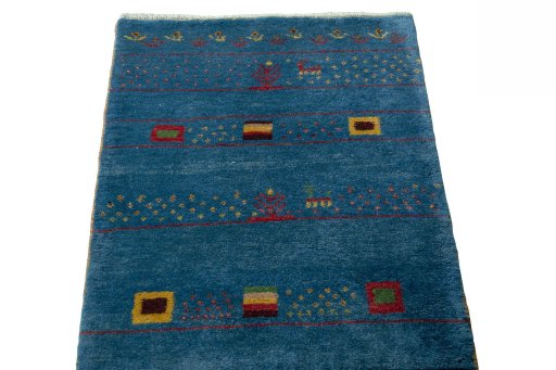 Surface texture of 2000s Persian Gabbeh rug with natural Wool and intricate pattern
