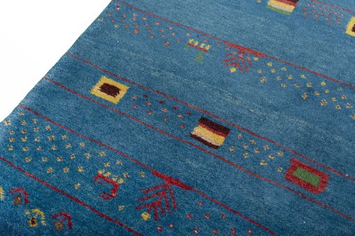 Backside of handmade 2000s Persian Gabbeh rug showing knot structure and weave density