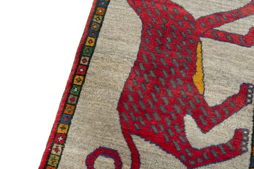 Backside of handmade 2000s Persian Gabbeh rug showing knot structure and weave density