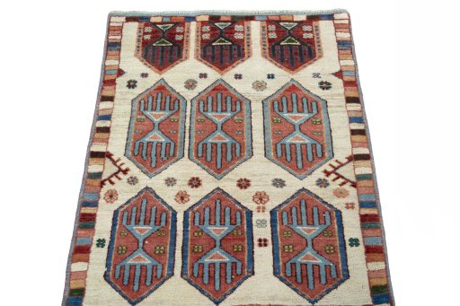 Surface texture of 2000s Persian Gabbeh rug with natural Wool and intricate pattern